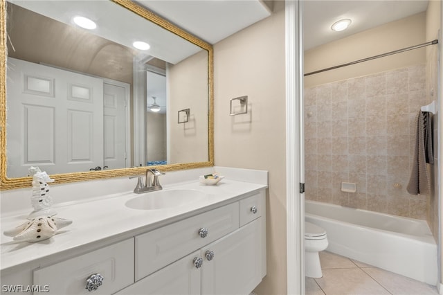 full bathroom with vanity, toilet, tile patterned floors, and tiled shower / bath