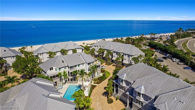 birds eye view of property featuring a water view and a view of the beach