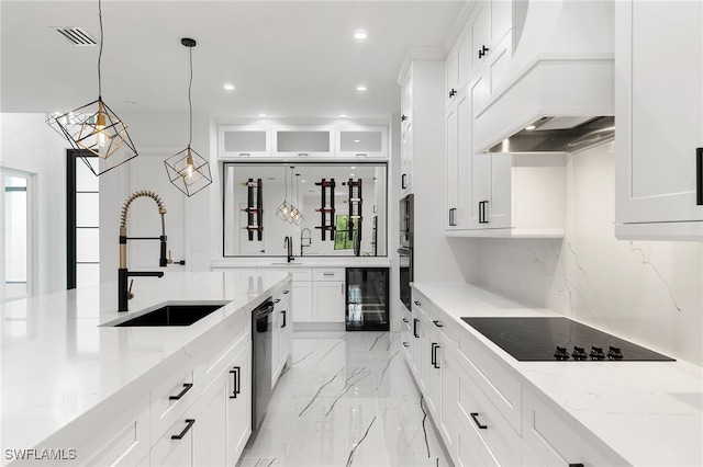 kitchen with wine cooler, sink, white cabinets, appliances with stainless steel finishes, and decorative light fixtures