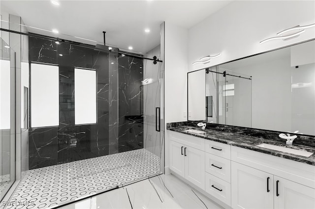 bathroom featuring walk in shower and vanity