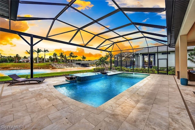 pool at dusk with pool water feature, a water view, a patio area, and a lanai