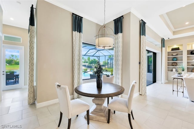 tiled dining space featuring crown molding and built in features