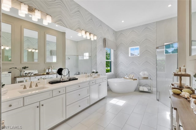 bathroom with plus walk in shower, vanity, and crown molding