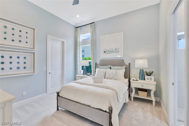 carpeted bedroom with multiple windows, crown molding, and ceiling fan