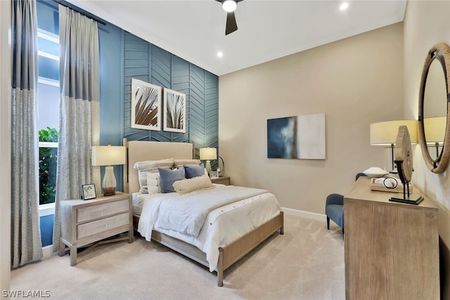 bedroom with light colored carpet and ceiling fan