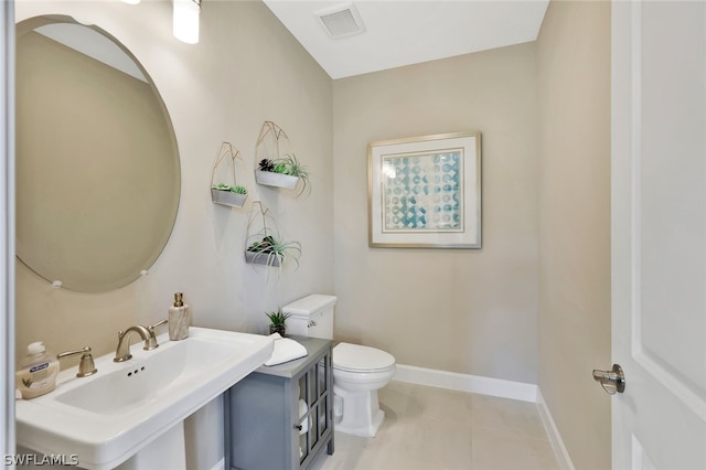 bathroom with tile patterned floors, toilet, and sink