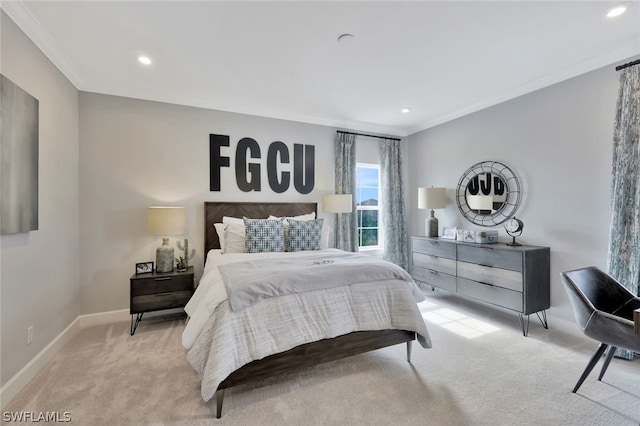 bedroom with light colored carpet and crown molding