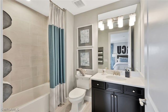 full bathroom with shower / bath combo with shower curtain, vanity, and toilet