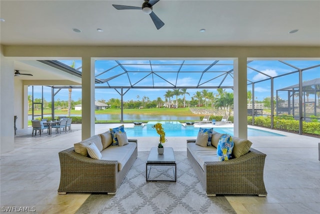 view of patio with an outdoor living space, a water view, and a lanai