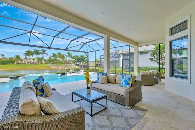 view of patio featuring glass enclosure, an outdoor living space, a water view, and pool water feature