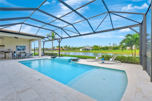 view of pool featuring glass enclosure, ceiling fan, a water view, and a patio