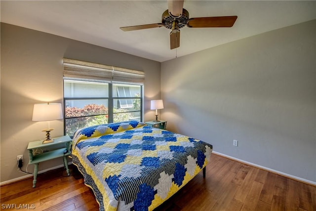 bedroom with hardwood / wood-style flooring and ceiling fan