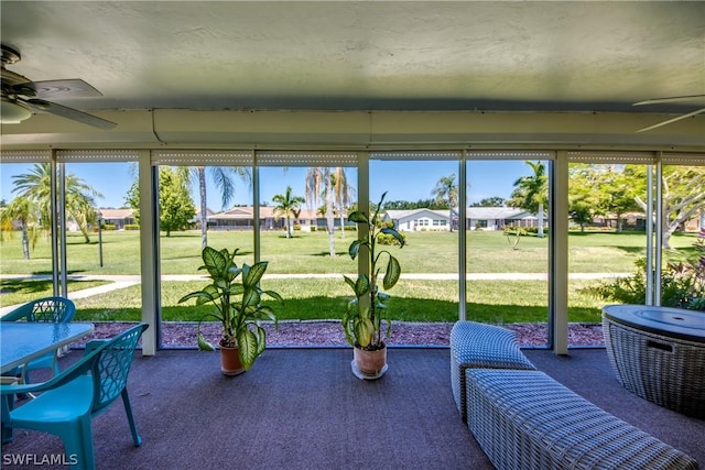 sunroom / solarium with ceiling fan