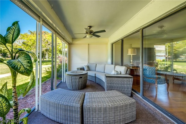 sunroom / solarium featuring ceiling fan