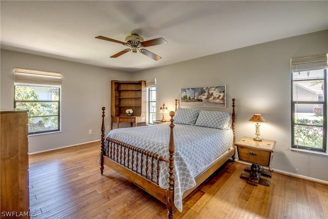 bedroom with hardwood / wood-style floors and ceiling fan