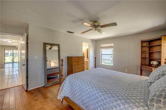 bedroom with ceiling fan and light hardwood / wood-style flooring