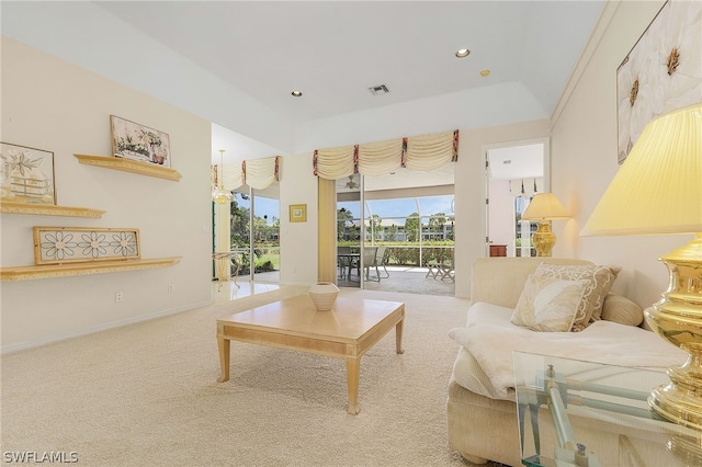 sitting room featuring carpet and a tray ceiling