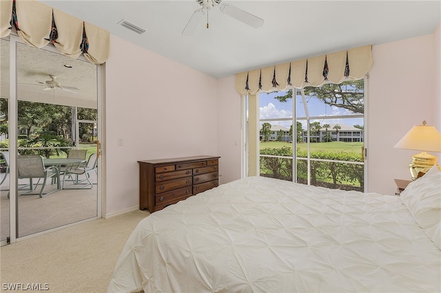 carpeted bedroom with access to outside and ceiling fan