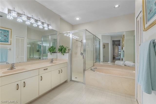 bathroom featuring tile patterned flooring, vanity, and independent shower and bath