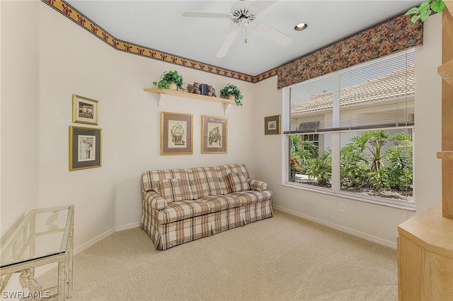 sitting room featuring carpet flooring and ceiling fan