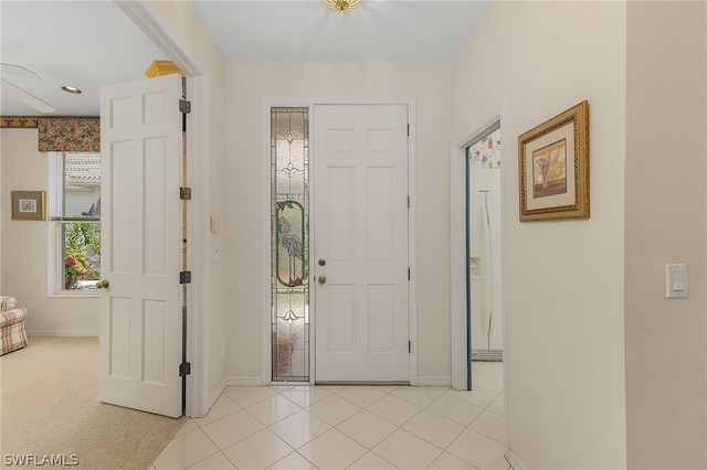 foyer entrance with light carpet