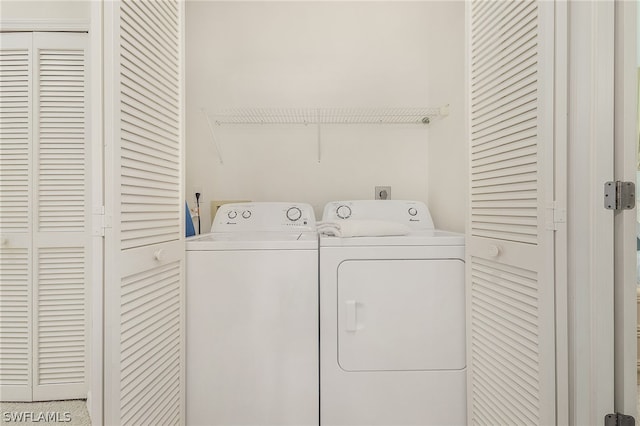 laundry room featuring washing machine and dryer