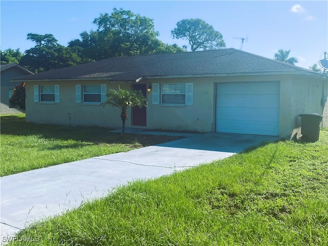 ranch-style home with a garage and a front yard