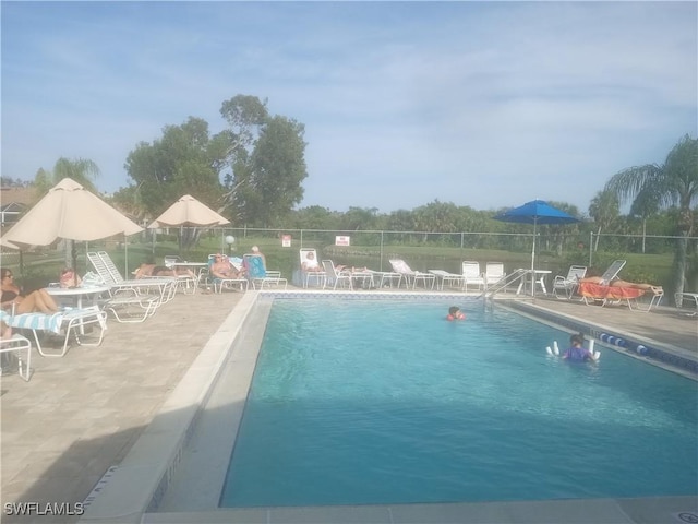 view of swimming pool featuring a patio