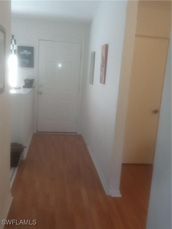 hallway featuring wood-type flooring