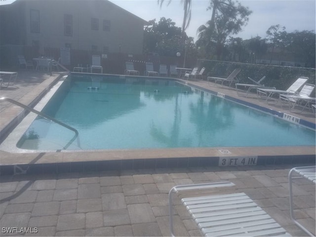 view of swimming pool with a patio