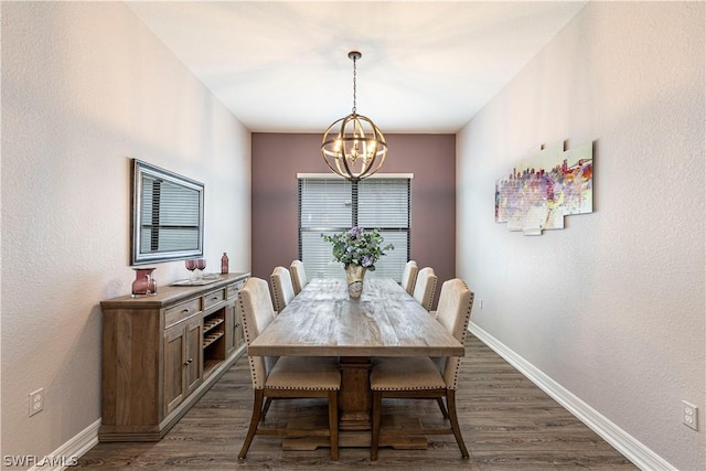 dining space featuring dark hardwood / wood-style floors and a notable chandelier