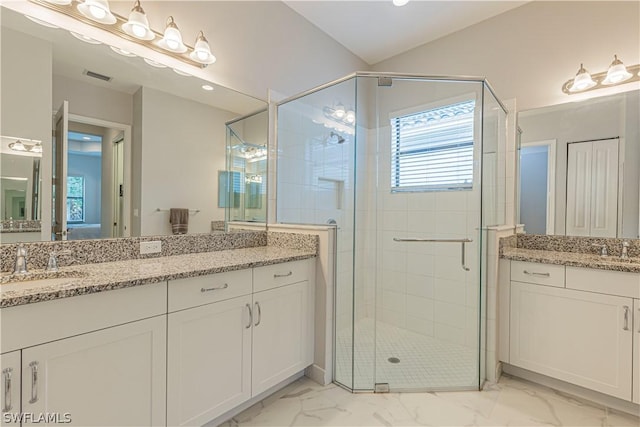 bathroom featuring vanity and walk in shower