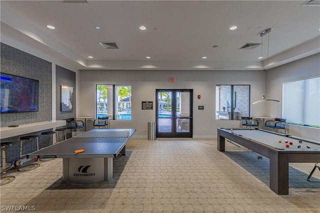 recreation room with french doors, light colored carpet, and pool table