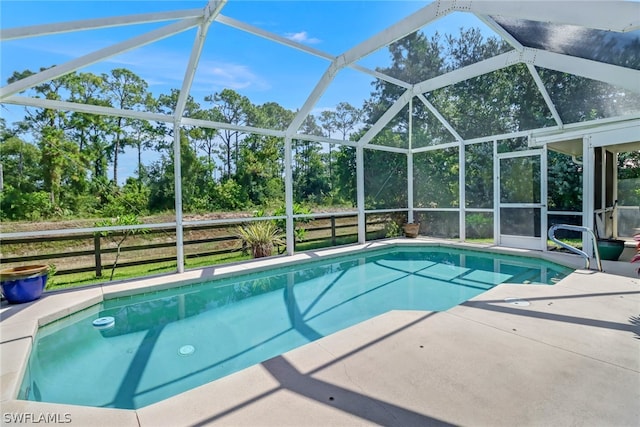 view of pool with a lanai and a patio area