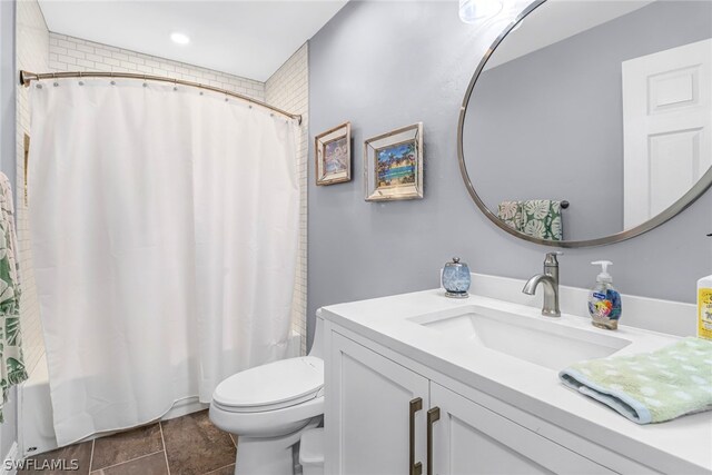 full bathroom featuring vanity, toilet, tile patterned flooring, and shower / bath combination with curtain