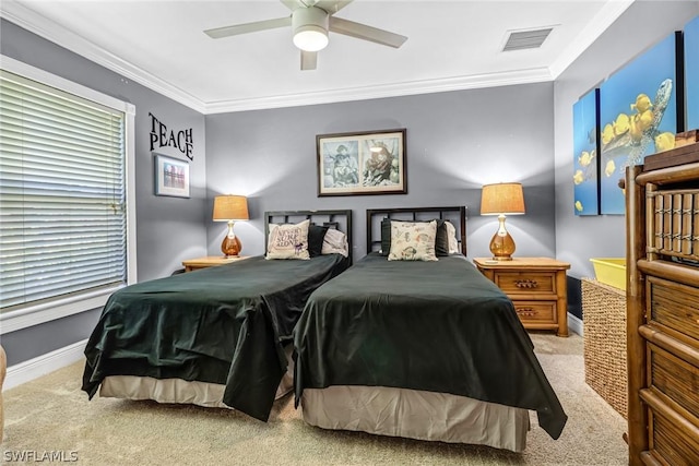 carpeted bedroom featuring ornamental molding and ceiling fan