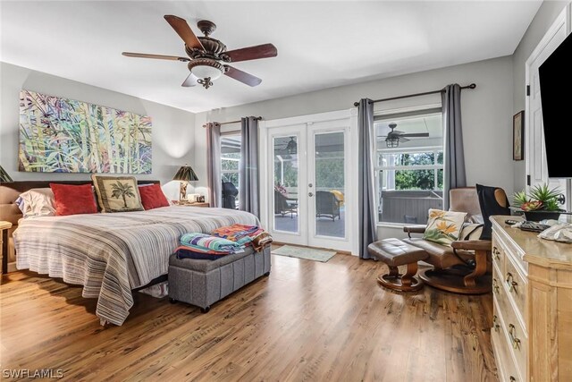 bedroom featuring wood-type flooring, access to outside, french doors, and ceiling fan