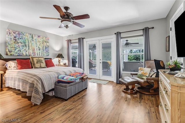 bedroom with wood-type flooring, access to outside, ceiling fan, and french doors