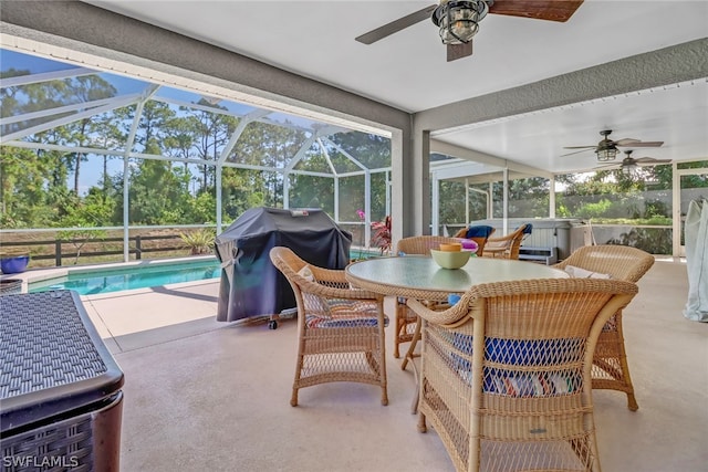 sunroom featuring ceiling fan