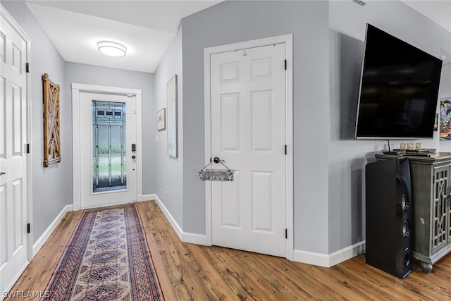 foyer entrance with hardwood / wood-style flooring