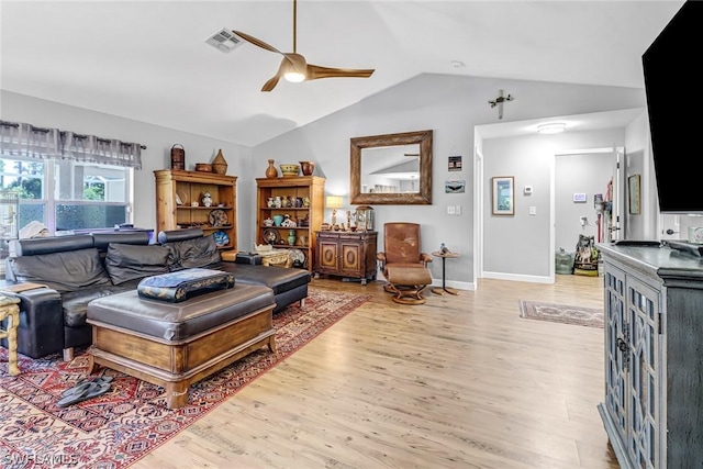 living room featuring lofted ceiling, light hardwood / wood-style flooring, and ceiling fan