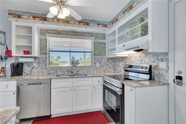 kitchen with white cabinets, decorative backsplash, stainless steel appliances, and sink