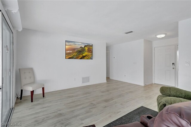 living room with light hardwood / wood-style floors