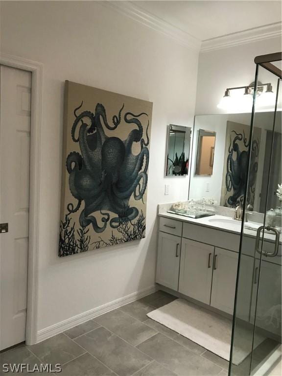 bathroom with tile patterned flooring, vanity, and crown molding