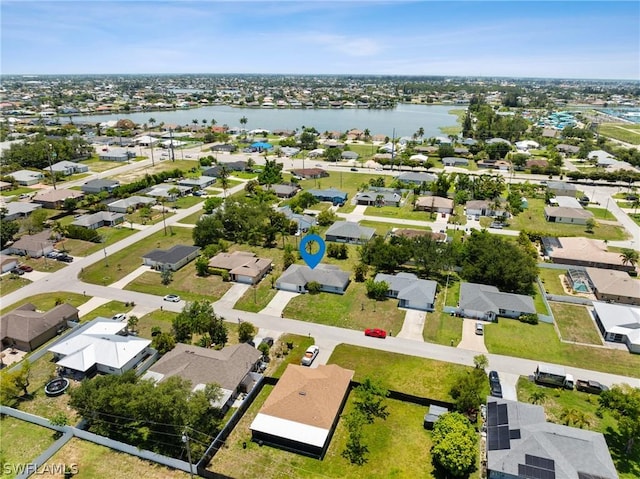 drone / aerial view with a water view