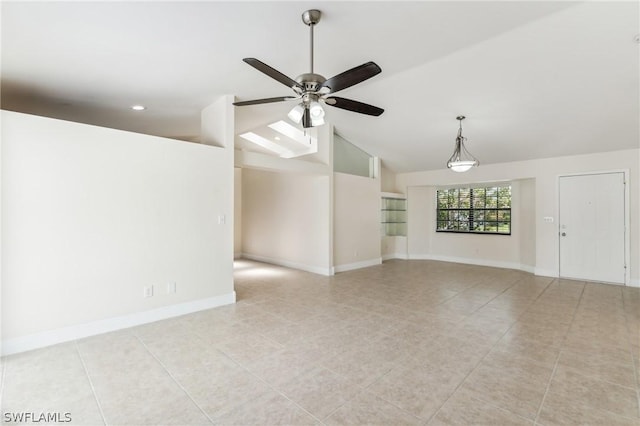 unfurnished living room featuring ceiling fan, light tile patterned floors, and lofted ceiling