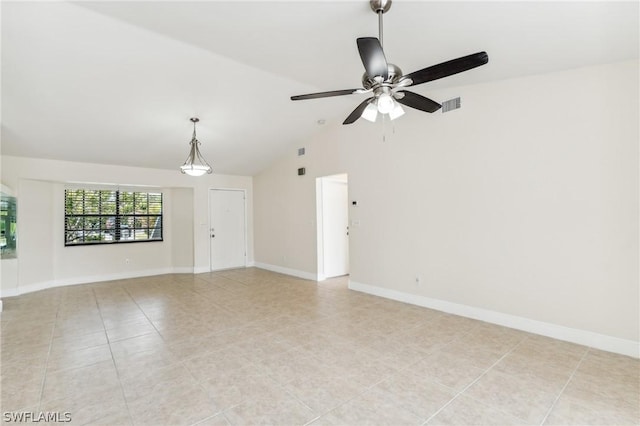 tiled empty room featuring ceiling fan and lofted ceiling