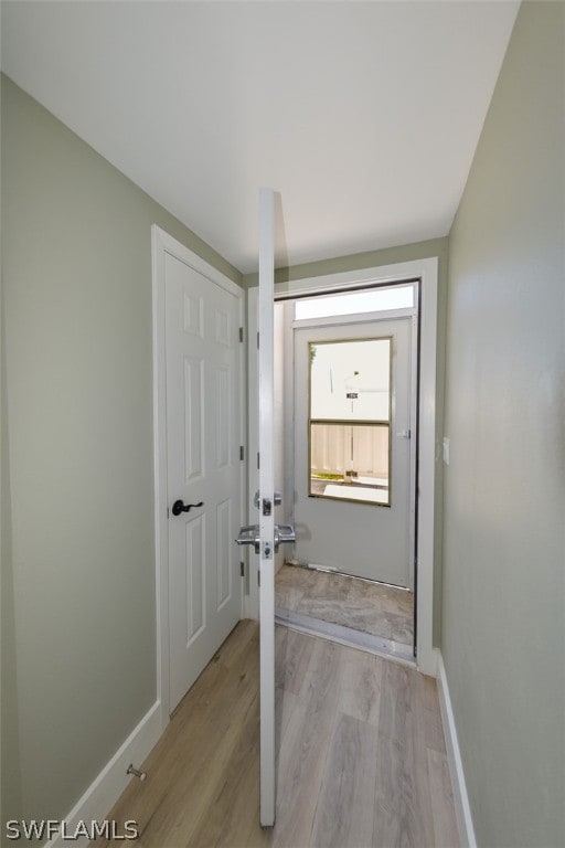 doorway with light hardwood / wood-style floors