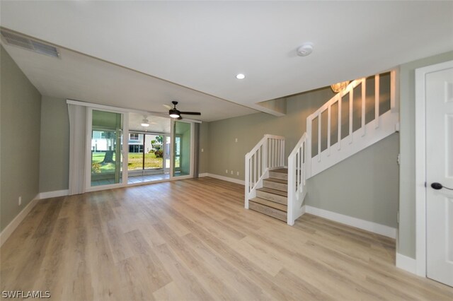 unfurnished living room with ceiling fan and light hardwood / wood-style flooring