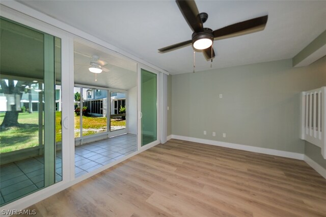 unfurnished room with ceiling fan and light hardwood / wood-style floors